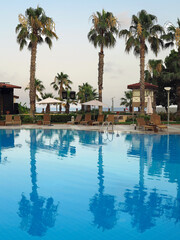 Luxury blue swimming pool at tropical resort