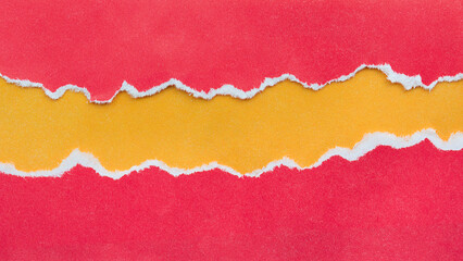 torn red paper with an orange substrate
