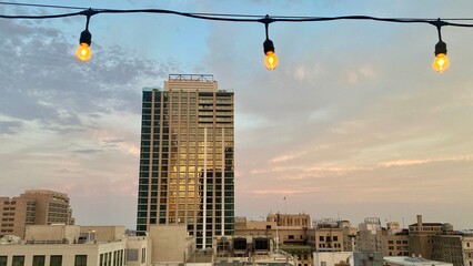 LOS ANGELES, CA, JUN 2021: new multi-storey apartment building in Downtown with sunset clouds and...