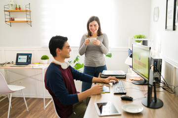 Fototapeta premium Excited coworkers working together