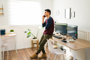 Latin man calling a client about his investments