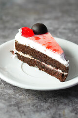 chocolate and cream cake on a plate on table 