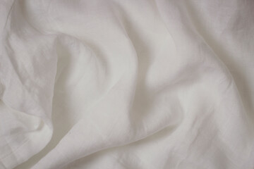 White crumpled linen fabric texture background. Natural linen canvas organic eco textiles...