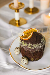 Delicious Easter cakes and eggs on white table with flowers 