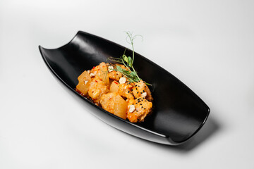 Teriyaki, Asian food, Chinese dishes, teriyaki on a black long plate with microgreens