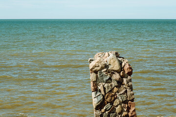 Ruins of bunkers on the beach of the Baltic sea, part of an old fort in the former Soviet base Karosta in Liepaja, Latvia