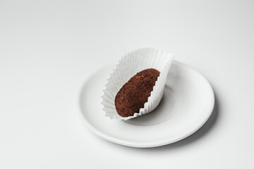 sweet dessert with chocolate on a plate on a white background
