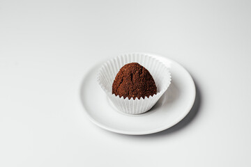 sweet dessert with chocolate on a plate on a white background