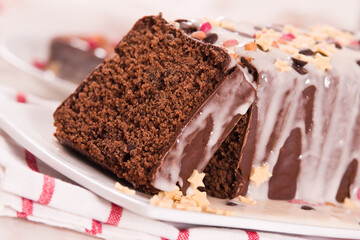 Sponge cake with white frosting and sugars.
