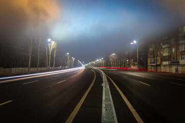 Fog over night city highway