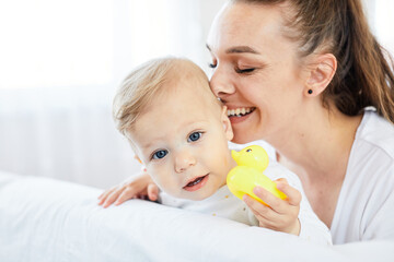 mother child baby having fun family happy childhood care cheerful cute boy son love cheerful young woman