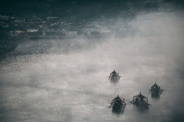 Fototapeta premium Sunrise with fog over Ban Rak thai, chinese village near a lake in Mae Hong Son, Thailand