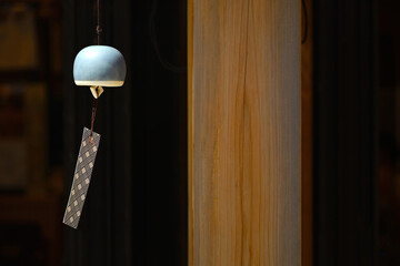 The eaves of a shop where a wind chime called "Furin", a Japanese summer tradition, is hung.