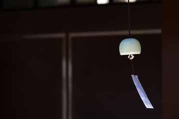 The eaves of a shop where a wind chime called "Furin", a Japanese summer tradition, is hung.
