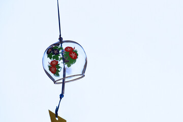 The eaves of a shop where a wind chime called "Furin", a Japanese summer tradition, is hung.