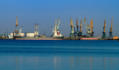 Fototapeta premium Port cranes and raid of the port in Berdyansk before the military aggression of Russia
