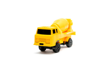 Colorful little mini yellow plastic concrete mixer, truck, lorry, car automobile toy isolated on...