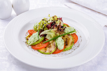 grilled vegetables on a white plate side view