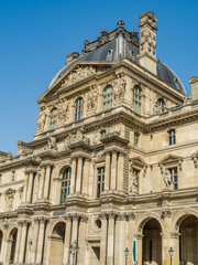 Fototapeta na wymiar Pavillon Richelieu of the Louvre Palace with blue sky in Paris