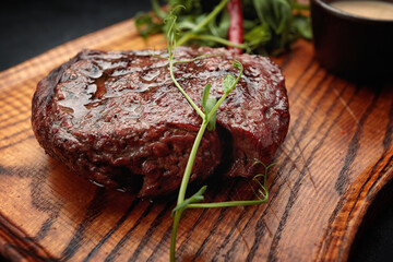 Meat steak on the wooden board