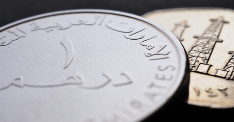 Translation: 1 dirham United Arab Emirates. UAE coins closeup. National currency of  Emirates. Money horizontal stories. News about economy or finance. Dhs. Bank and loan. Savings and interest. Macro