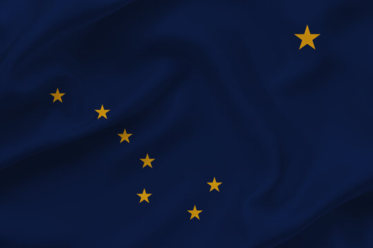 Alaska flag on waving silk background. Fabric texture design. 