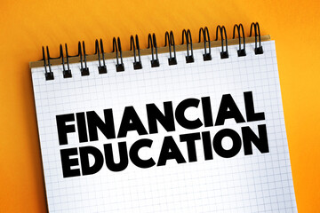 Financial Education - ability to manage personal finance effectively, text concept on notepad