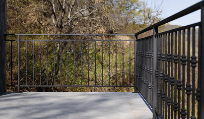 Modern metal railings and handrails in the loft style. The metal is treated with a primer and...