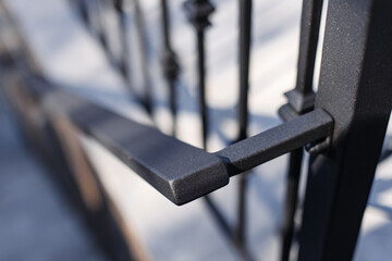 Close up metal railings and handrails in the loft style. The metal is treated with a primer and anti-corrosion paint. Interior design in industrial style.