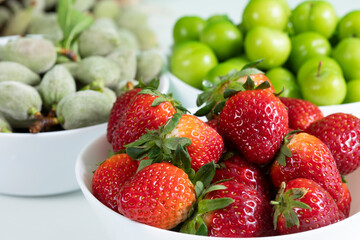 srawberries, almond, plum at supermarket