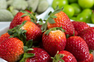 srawberries, almond, plum at supermarket