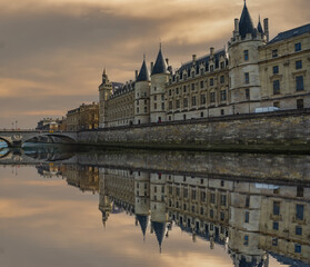 Historic buildings and The Louvre Palace on Seine river in Paris