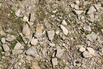 grungy stones (post construction) on grass