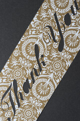 fancy paper stencil with the word 