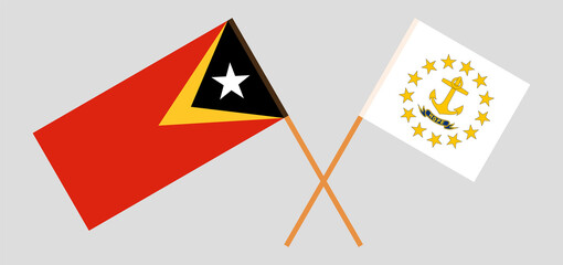 Crossed flags of East Timor and the State of Rhode Island. Official colors. Correct proportion