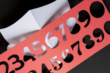 paper stencil with numbers on a black and white background