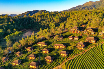 Aerial view of Sunrise with fog over Ban Rak thai, chinese village near a lake in Mae Hong Son, Thailand
