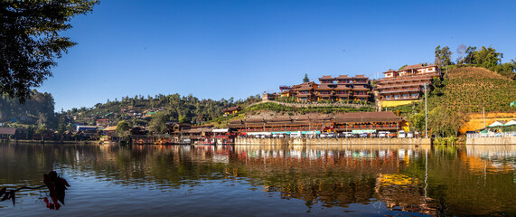 Fototapeta premium Sunrise with fog over Ban Rak thai, chinese village near a lake in Mae Hong Son, Thailand