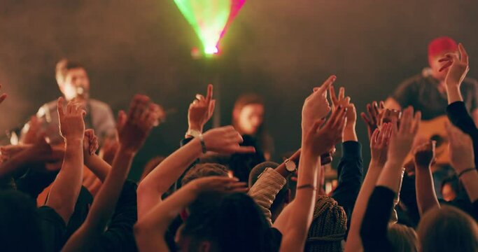 You know the musics good when the crowd gets grooving. 4k video footage of a crowd of people cheering and dancing during a live musical performance.