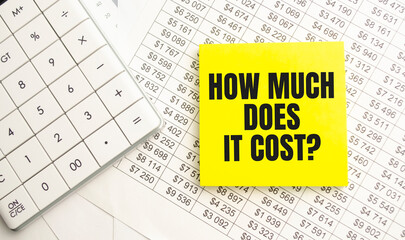 How Much Does it Cost. Business concept. Text on white notepad paper on light background