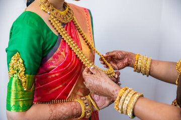 South Indian Tamil bride's wearing her wedding outfit and jewellery close up