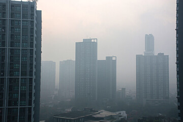 Residential buildings are covered with pollution dust.