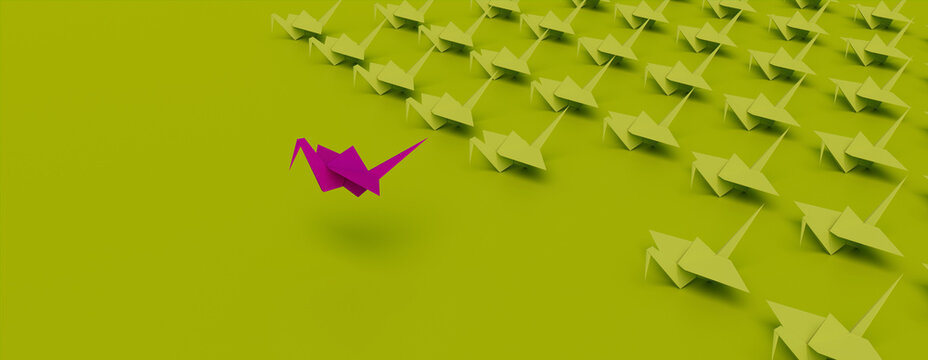 Magenta Origami Bird Leading the Group. Minimalist Business Concept on Green Background with Copy Space.