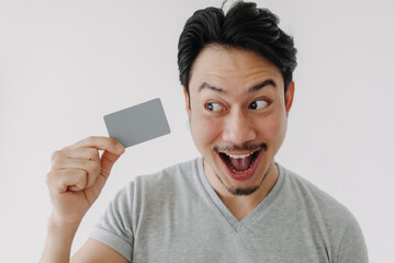 Happy funny face Asian man show off his empty card on white background.