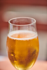 one glass of apple juice is on the table