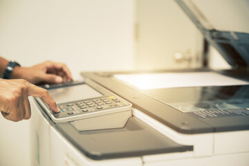 Copiers printer, Close up hand office man press copy button on panel to using the copier or...