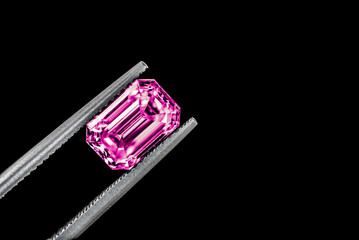 Purple Precious Gemstone in Tweezers