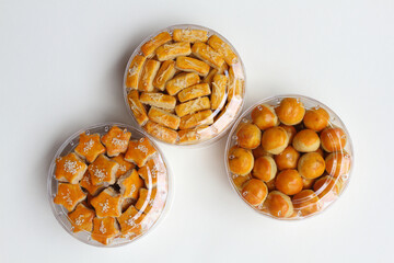 Three jars of Kue Kacang (Peanut cookies), Kaasstengels (Dutch cheese finger cookies), and Nastar (Dutch pineaple tarts).
