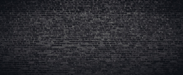 Fototapeta na wymiar Black or dark gray brick wall texture background