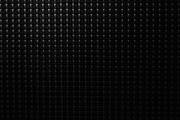 metal dots on black wall background